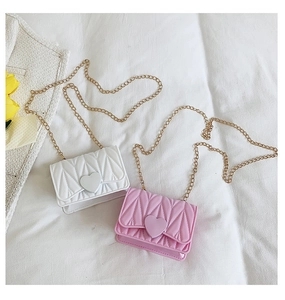 Detailed view of pink and white heart silicone mini chain bags with diamond lattice texture