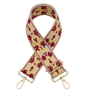 Detail of colorful jacquard embroidery strap with golden metal lobster clasps