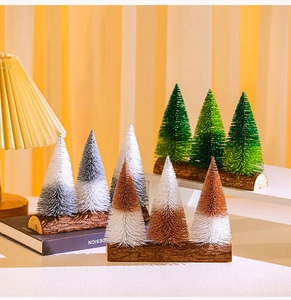Miniature Christmas trees in green and silver with natural wooden bases for table decor