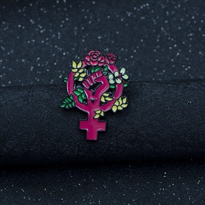 Feminist symbol enamel pin featuring pink Venus sign with roses and floral pattern