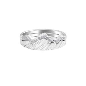 Detailed macro view of silver mountain peaks wedding rings with pave-set cubic zirconia