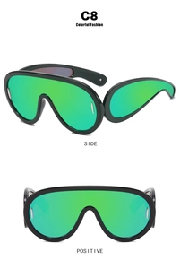 Front and side views of futuristic oversized wrap sunglasses with green mirrored lenses
