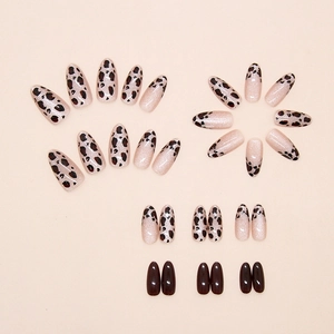 Detailed view of hazel leopard print and cat eye press-on nails in almond shape