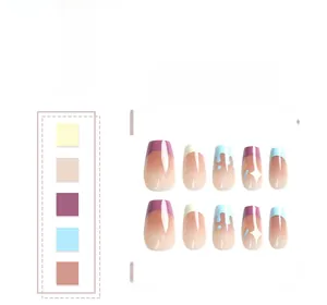 Detail of blue and purple French press-on nails with white stars and fluid drip patterns