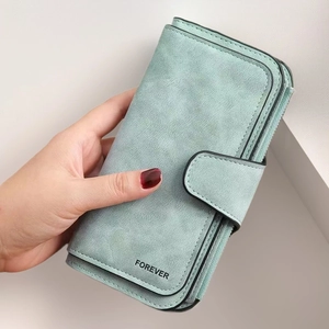 Detail of blue matte long wallet with zipper and buckle featuring FOREVER lettering