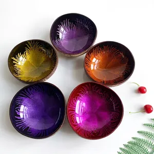 Set of five handmade coconut bowls with colorful shell inlay and natural texture