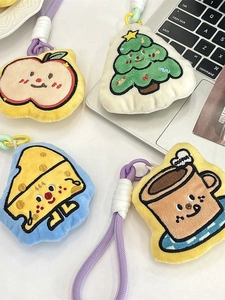 Plush cartoon charms set with apple, tree, cheese and coffee cup embroidery on white desk