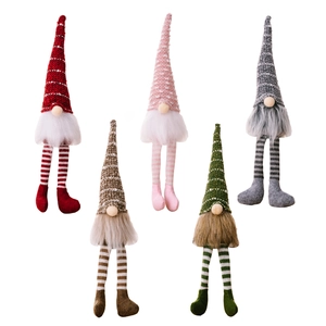 Five colorful Christmas gnomes with striped legs and knit hats on a white background
