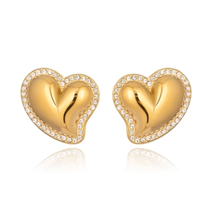 Detailed view of gold heart earrings featuring polished metal and sparkling zircon border