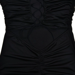 Detail of black backless dress featuring criss-cross lace-up and ruched hollow-out waist