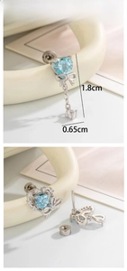 Detail of light blue heart zircon earring with bow element and 1.8cm size mark
