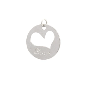 Macro shot of silver circular pendant with hollow heart and Love engraving