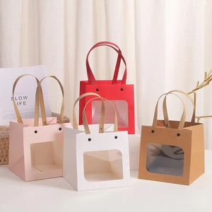 Square window gift bags in red, white, pink, and kraft paper with braided handles