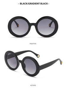 Front and 45-degree views of retro round frame sunglasses with gradient black lenses