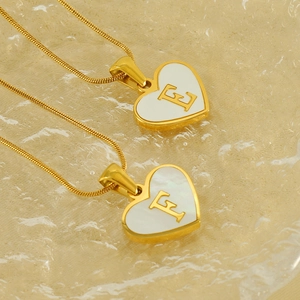 18K gold plated heart pendant necklace with shell inlay and metallic initial letter