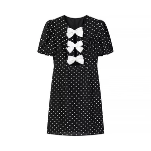 Sweet vintage black polka dot mini dress with white bows and puffy short sleeves