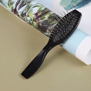Oval air cushion hairbrush with fine steel needles and ergonomic black handle