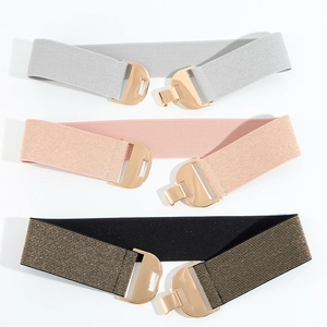 Three elastic waist belts in silver, pink, and black gold with metallic buckles