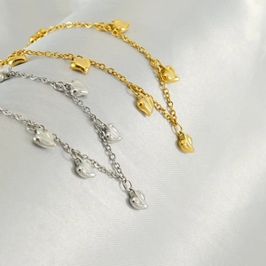 Collana in acciaio inox oro e argento con ciondoli a cuore 3D su seta bianca