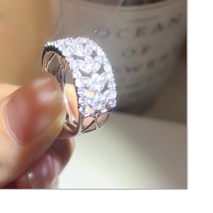 Elegant silver lace-style hollow leaf ring featuring sparkling white cubic zirconia stones