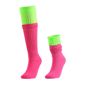 Pink and lime green slouch socks in contrast colors made of warm knitted cotton blend