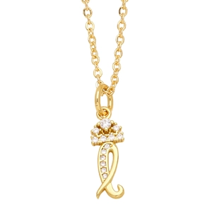 Close-up of golden crown pendant with sparkling crystals and curved L letter detail