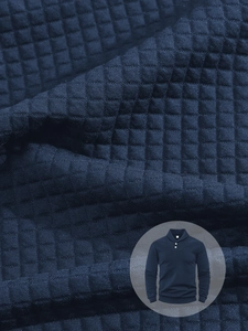 Detailed macro view of navy men's waffle knit sweatshirt with polo collar and buttons