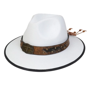 Close-up of white western cowboy hat with brown leather band and bronze bull head buckle