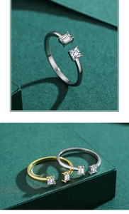 Macro detail of adjustable silver and gold rings with square and baguette cut zircons
