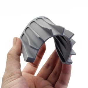 Close-up of flexible grey silicone soap dish showing unbreakable and anti-rust features