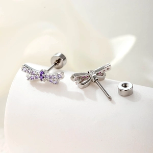 Silver dragonfly stud earrings with purple crystals and screw back closure design