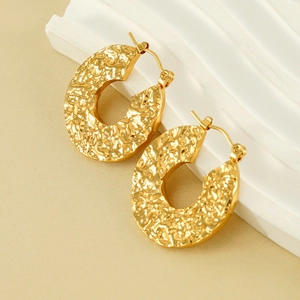 Gold plated hollow geometric hoop earrings with irregular hammered lava texture