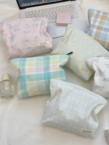 Floral and checkered cotton travel cosmetic bags with zipper closure and logo patch