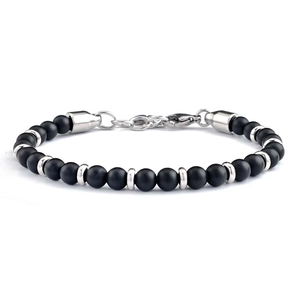 Detail of matte black beads bracelet with silver cylinder spacers and lobster clasp