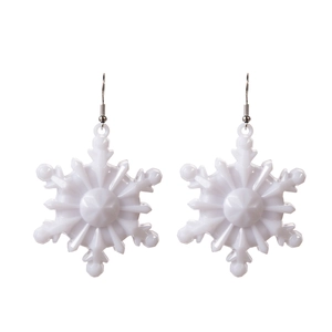 Close-up of white snowflake LED earrings with metal hooks on a clean white background