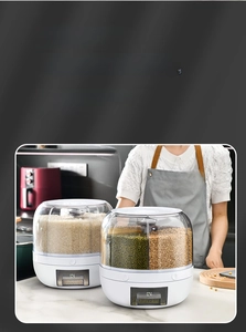 Close-up of a rotating multi-compartment cereal dispenser with a pull-out drawer