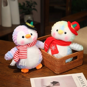 Plush Christmas penguins with colorful tie-dye fur, wearing hats and striped scarves