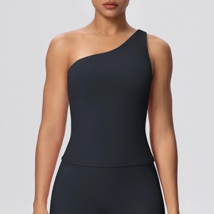 Detail of black one-shoulder yoga top showing high-elastic fabric and sleek fit on model
