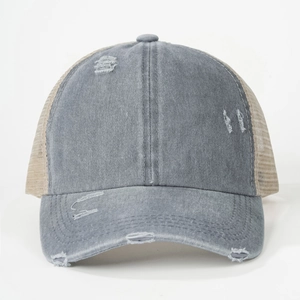 Detail of distressed grey cotton baseball cap with ponytail mesh and torn design