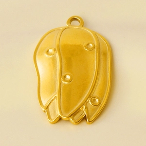 Detailed close-up of a gold 304 stainless steel flower bud pendant for jewelry making