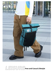 Outdoor waterproof travel backpack with roll-top closure and durable buckle detail