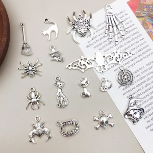 Set of 16 antique silver alloy Halloween charms with spider bat and skull designs