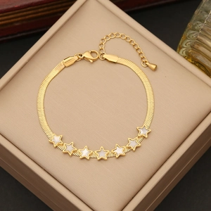Golden star charm snake chain bracelet with white shell inlays in jewelry box