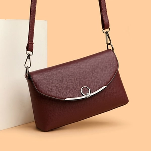 Elegant wine red crossbody bag with lychee texture and silver metal ring hardware