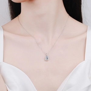 S925 sterling silver necklace with radiant emerald cut moissanite pendant on a model