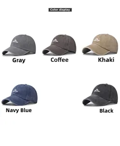 Five colors of washed cotton baseball caps with embroidered mountain peaks displayed in a row