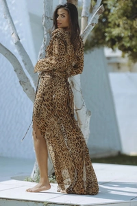 Detail of leopard print chiffon maxi dress featuring high slit and ruffle hem design