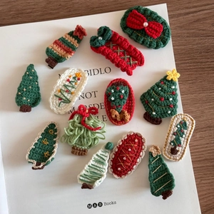 Collection of handmade crochet Christmas hair clips including trees and socks