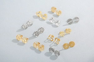 Detailed collection of assorted hollow stainless steel earrings with rhinestones and symbols