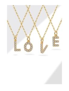 Detail of gold LOVE letter pendants with zircon inlay on S925 sterling silver necklaces